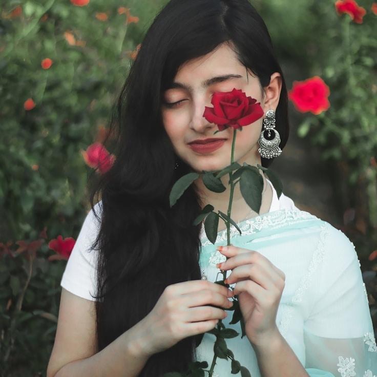 Kaveri Mehta, Lead Design Curator at MotorCraftMill, reviewing corporate floral arrangements